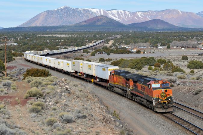Near Flagstaff, Julien got this shot with BNSF&rsquo;s &ldquo;great pumpkin&rdquo; in the lead. 