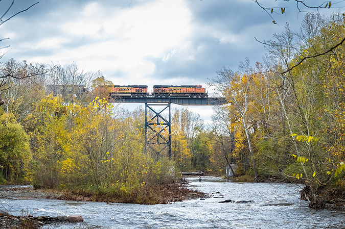 An all-BNSF consist leads a Norfolk Southern train over Elk Creek at Lake City, Pennsylvania. Photo by Mike Hauk. An all-BNSF consist leads a Norfolk Southern train over Elk Creek at Lake City, Pennsylvania. Photo by Mike Hauk.