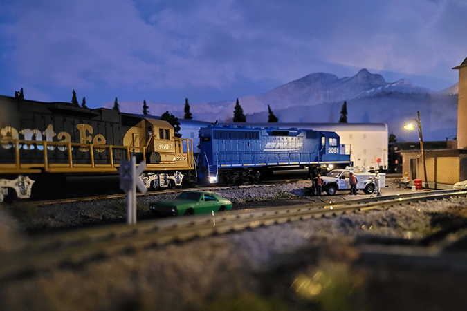 A blue BNSF locomotive railfans call the &ldquo;Smurf&rdquo; and Santa Fe &ldquo;Yellow Bonnet&rdquo; make an early night service stop.