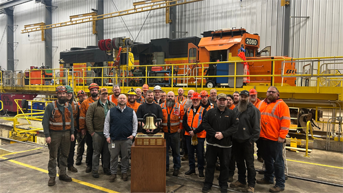 Team members on our Northwest Division pose with the Safety Bell Award in Vancouver, Washington. Team members on our Northwest Division pose with the Safety Bell Award in Vancouver, Washington.
