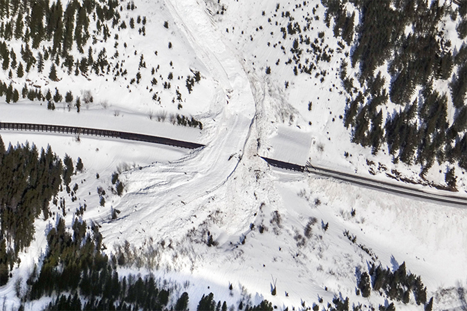  The path of this area&rsquo;s avalanches can be seen in the center. Underneath this path is a snow shed that is strategically placed to divert the snow over the tracks.