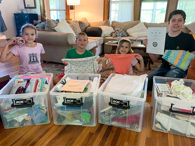 The O&rsquo;Donnell kids with their memory boxes, from left: Harper, with an art project; Ezra, with his baby blanket; Ivy, with a school hat and newborn onesie; Jones, with a Japanese diploma and a quilt.