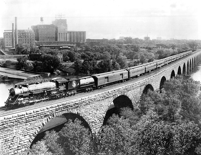 Great Northern&rsquo;s Empire Builder on the Stone Arch Bridge, part of the ten-mile stretch between Minneapolis and St. Paul