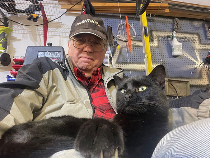 Haubrich with a cat named Ebony that he fostered